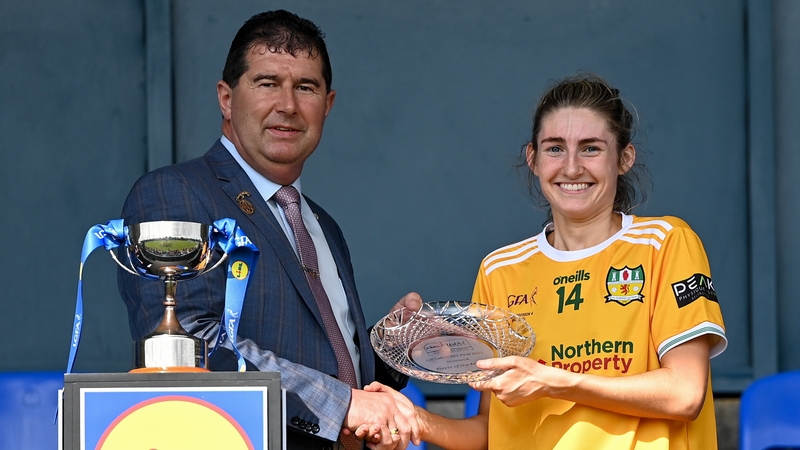 Uachtarán Cumann Peil Gael na mBan Mícheál Naughton presents the player of the match to Orlaith Prenter