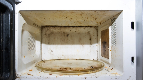 Food was being reheated in microwave on the floor of a barber premises (stock image)