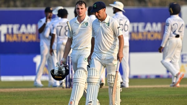 Lorcan Tucker and Andrew McBrine walk back to the pavilion at the end of the second day's play in Galle