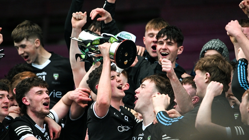 Sligo captain Canice Mulligan celebrates lifting the silverware with his team-mates