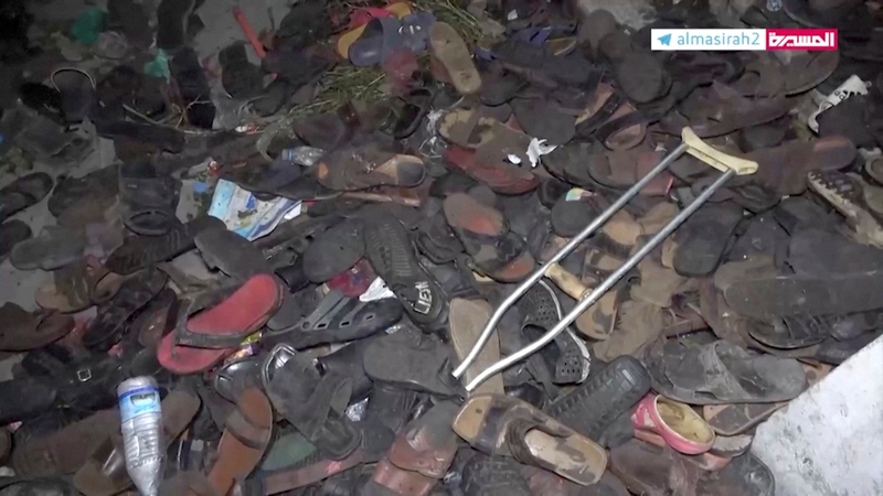 Abandoned footwear and other belongings lie on the ground after a stampede in Sanaa