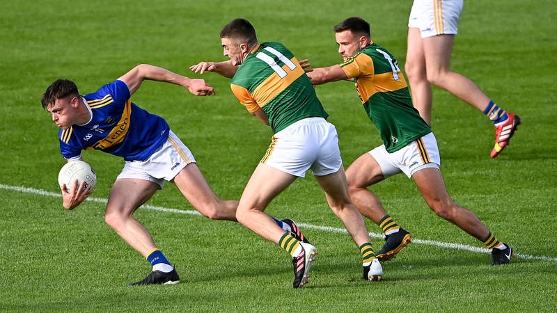 Conor Bowe of Tipperary (L) evades Kerry pair Seán O'Shea and Micheál Burns back in 2021