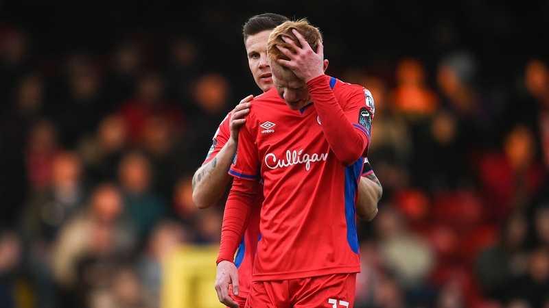 Shelbourne's Shane Farrell, right, is consoled by team-mate Luke Byrne after receiving a red card