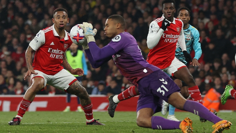 Southampton's Irish goalkeeper Gavin Bazunu (C) makes a save as Arsenal striker Gabriel Jesus looks on