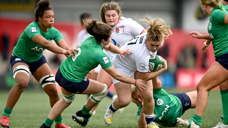 Mackenzie Carson of England is tackled by Ireland's Deirbhile Nic a Bháird