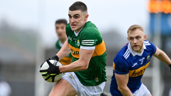 Kerry's Sean O'Shea breaks free from the clutches of Jimmy Feehan
