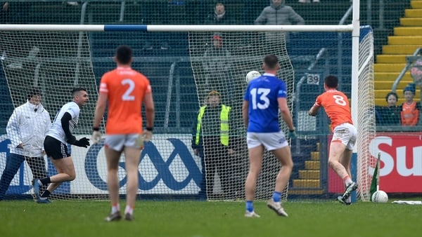 Ben Crealey palms the ball to the Cavan net