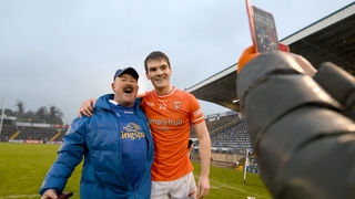 Armagh's Jarly Óg Burns poses for a photograph with Cavan supporter Pat McCoy