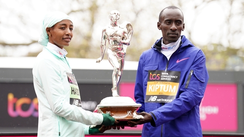 Sifan Hassan and Kelvin Kiptum pose with the Chris Brasher Sporting Life Trophy