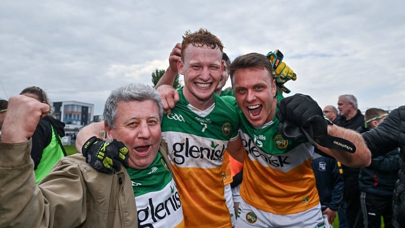Offaly supporter Mick McDonagh celebrates with Offaly players Ciaran Donnelly, centre, and Joe Maher after the win over Meath