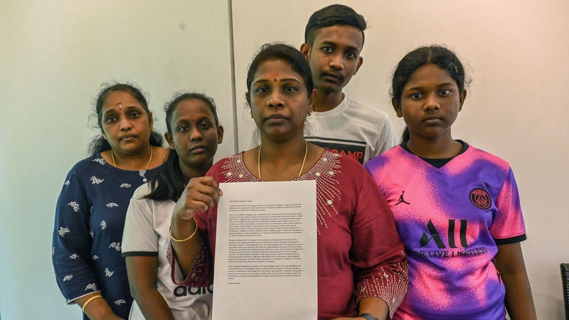 Leelavathy Suppiah, centre, sister of convicted drug trafficker Tangaraju Suppiah, with family members as she holds a petition letter to seek clemency in Singapore