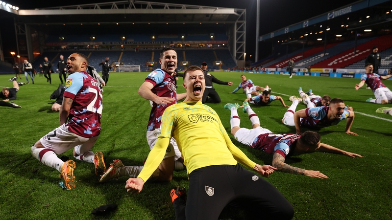 Burnley players celebrate going up as champions