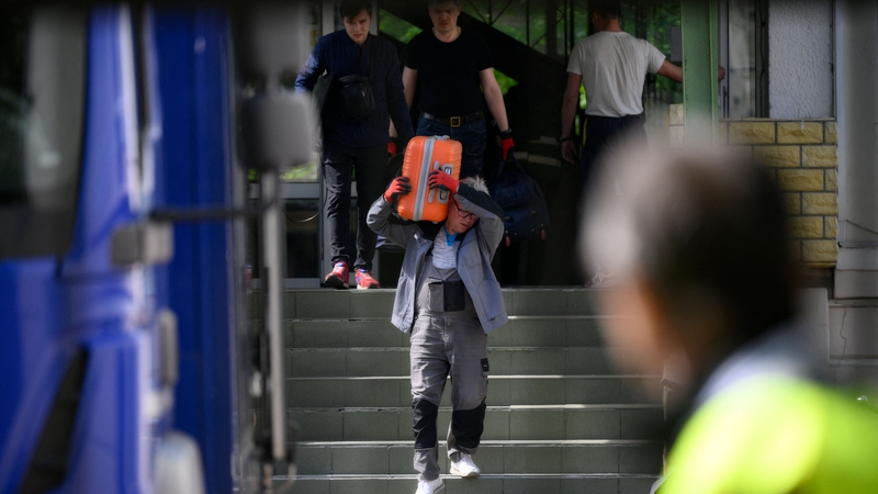 Authorities are seen at a former Russian high school in Warsaw, Poland