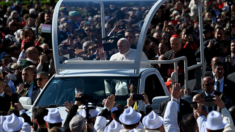 Pope Francis waves as he arrives to celebrate a holy mass at Kossuth Lajos' Square during his visit in Budapest