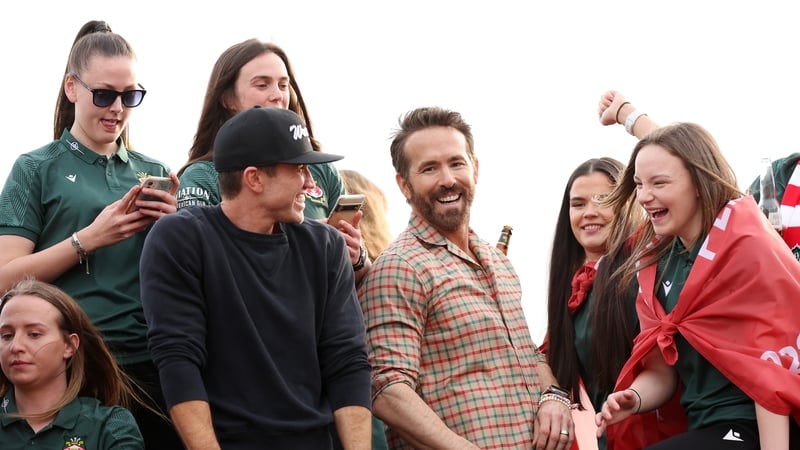 Rob McElhenney (wearing baseball cap) and Ryan Reynolds during Tuesday's parade