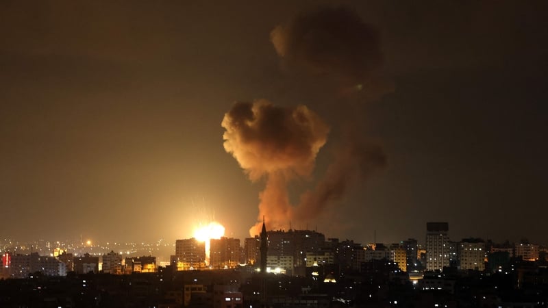 Smoke and flames rise above buildings after an Israeli airstrike in Rafah, southern Gaza Strip