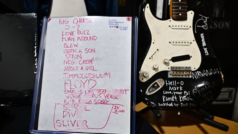 Kurt Cobain's smashed Fender Stratocaster is displayed beside the 1991 Smells Like Teen Spirit debut performance set list at Julien's Auctions in California