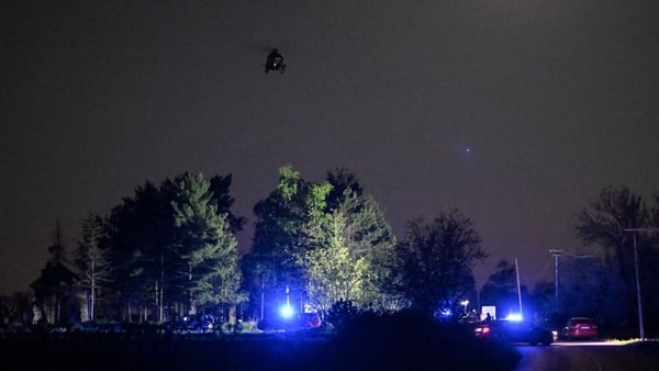 Policemen block the road near the Serbian village of Malo Orasje where eight people were killed and 13 injured in a shooting. Photo: Getty Images
