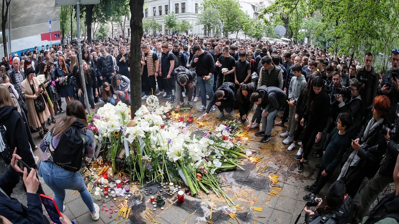 School children gather to light candles for the victims near the 'Vladislav Ribnikar' primary school earlier this month