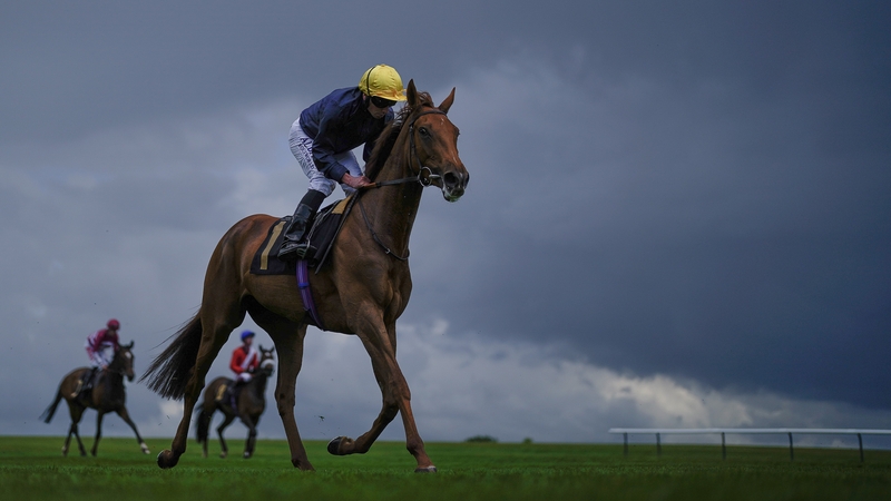 Infinite Cosmos and Ryan Moore head back to the winners' enclosure after scoring in the penultimate race on the card at Newmarket