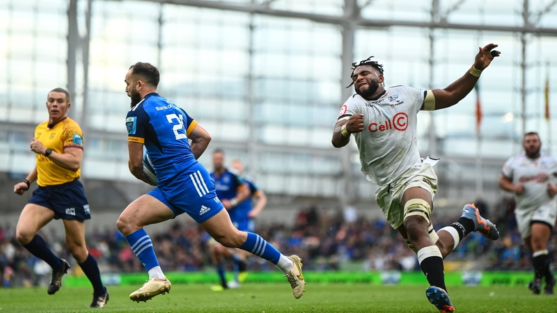 Jamison Gibson-Park evades the tackle of Vincent Tshituka of Cell C Sharks on his way to scoring Leinster's fifth try