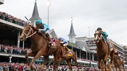 Mage, ridden by jockey Javier Castellano crosses the finish line to win the 149th running of the race