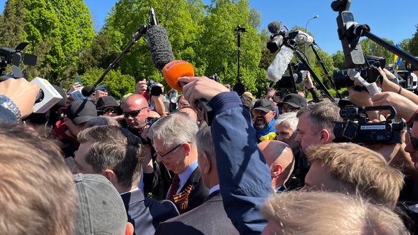 Russia's ambassador to Poland Sergei Andreyev (centre, wearing ribbon) arriving at the Soviet Military Cemetery in Warsaw