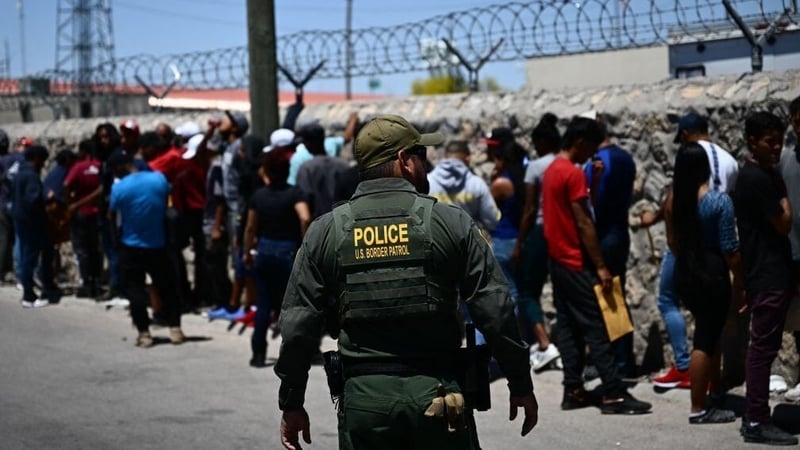 Migrants wait to be processed in El Paso, Texas after crossing the US-Mexico border