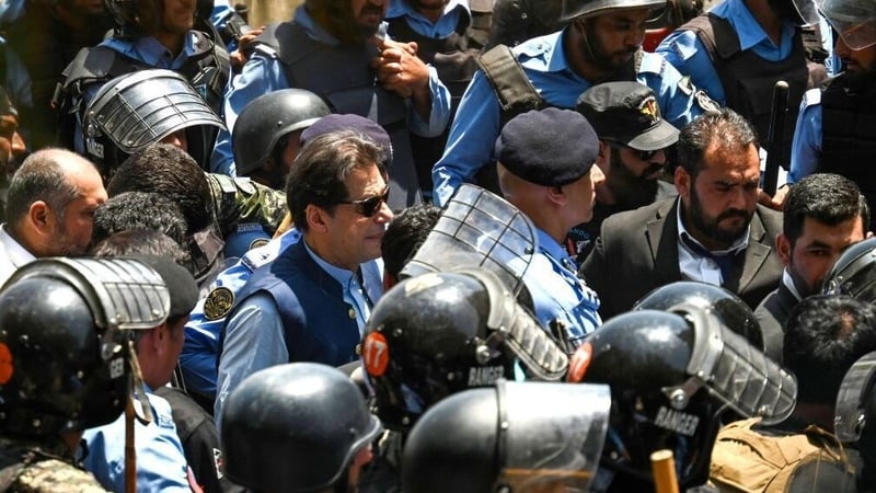 Police escorted Imran Khan to his court appearance today