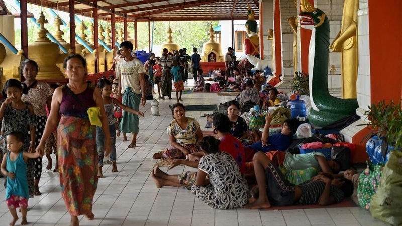 People shelter at a monestary in Sittwe, Myanmar ahead of the expected arrival of the weather system