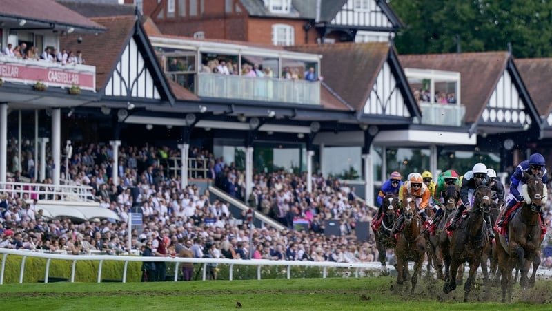 Saffie Osborne and Metier (L, orange) on their way to winning the Chester Cup