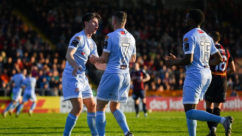 Ollie O'Neill of Derry City, left, celebrates with teammate, Michael Duffy after the only goal at Dalymount