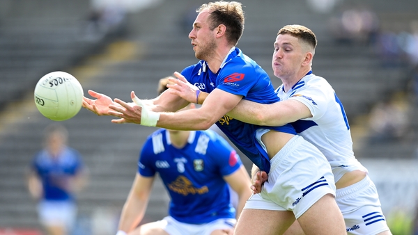 Padraig Faulkner of Cavan is challenged by Evan O'Carroll