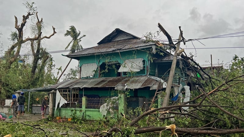 Local residents check the damages after Cyclone Mocha's crashed ashore, in Kyauktaw in Myanmar's Rakhine state