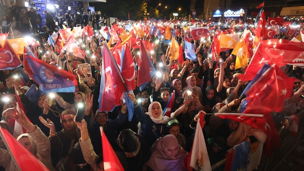 Supporters of Turkish President Recep Tayyip Erdoğan celebrate at the AK Party headquarters