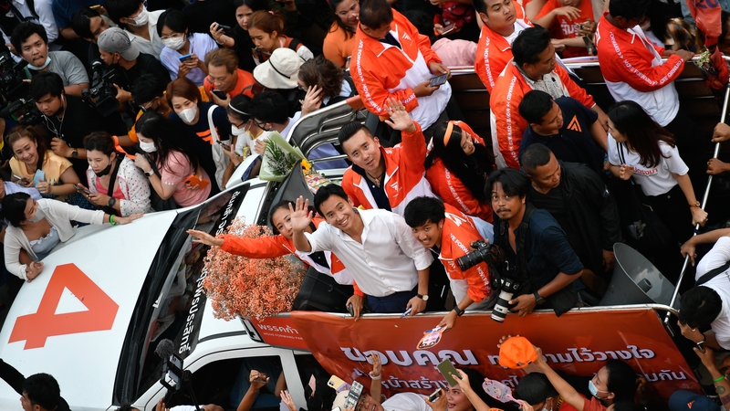 Move Forward party leader and prime minister candidate Pita Limjaroenrat waves to supporters as they celebrate the party's election results