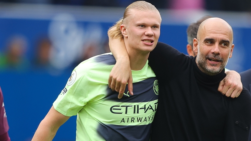 Pep Guardiola (R) celebrates with Erling Haaland after Manchester City beat Everton