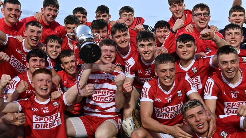 The Cork side celebrate with the cup after their win over Clare