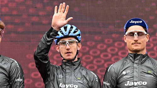 Eddie Dunbar (l) waves to the crowd during Tuesday's event