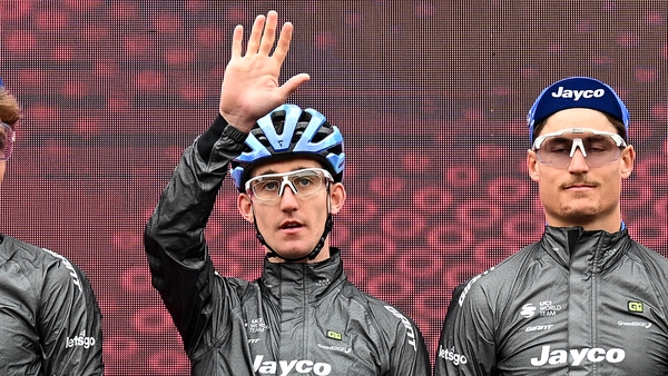 Eddie Dunbar (l) waves to the crowd during Tuesday's event