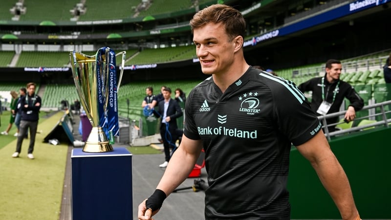 Josh van der Flier walks past the trophy at the Aviva Stadium