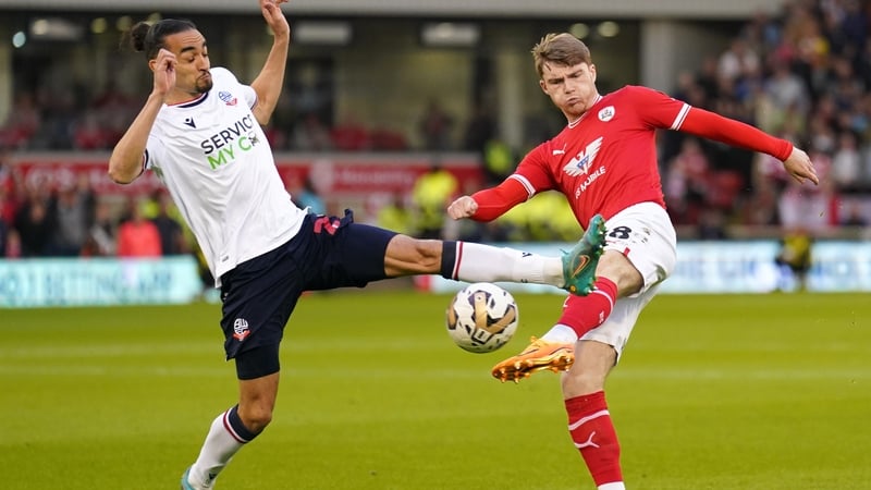 Barnsley's Luca Connell (right) has a shot blocked by Bolton Wanderers' Randell Williams