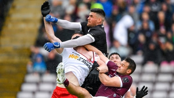 Galway keeper Conor Gleeson taking man and ball against Tyrone