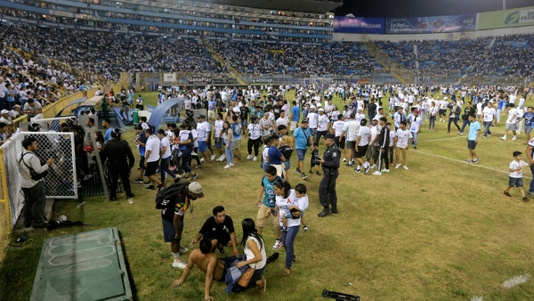 Stampede apparently started after a stadium gate fell, causing people to crowd together