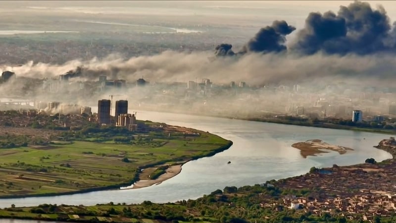 Black smoke covers the sky above the capital Khartoum on 19 April