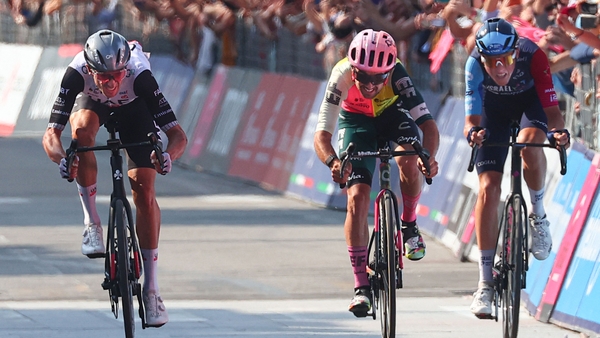 Brandon McNulty (L) surges past Ben Healy (c) and Marco Frigo on the final stretch to the line