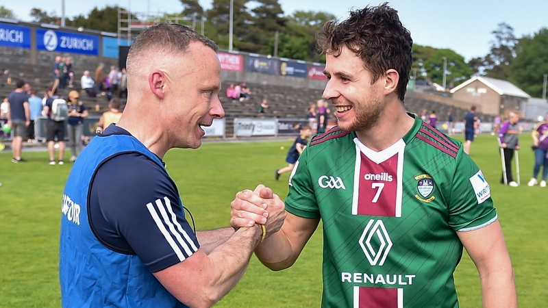Westmeath manager Joe Fortune celebrates with Robbie Greville