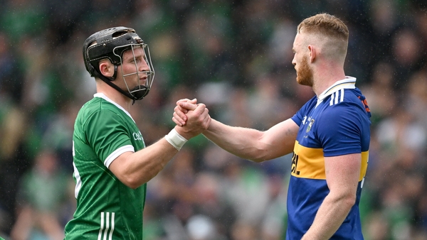 Peter Casey (left) and Michael Breen shake hands at full-time