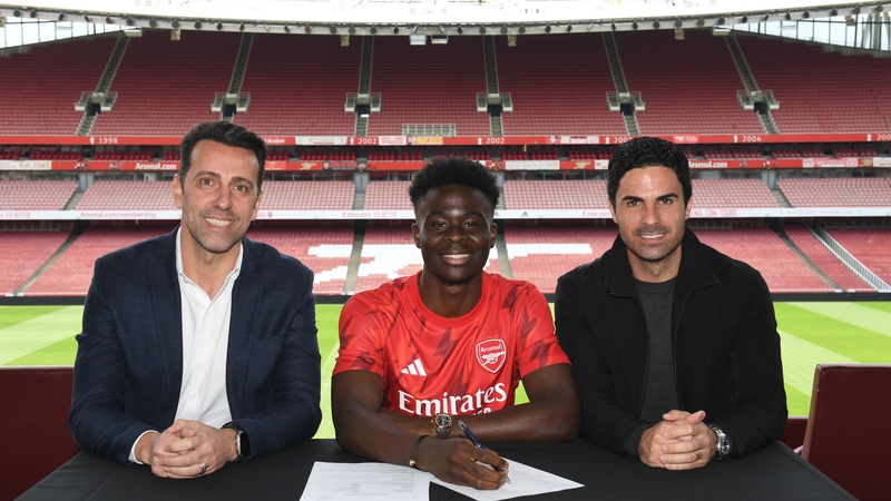 Saka, flanked by sporting director Edu and manager Mikel Arteta, came through Arsenal's Hale End academy