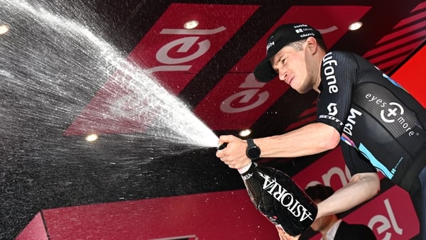 Alberto Dainese celebrates his stage win